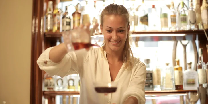 A woman in white dress shirt.