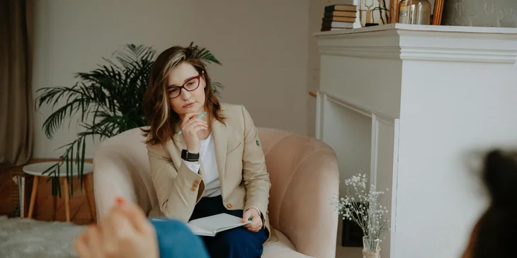 A behavior technician listens intently to her client.