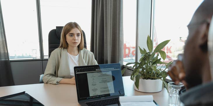 A woman answering behavioral interview questions