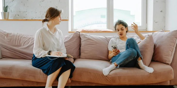 A behavioral specialist assessing a patient's behavior.