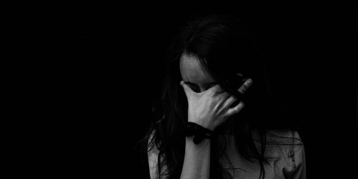 A woman crying through bereavement.