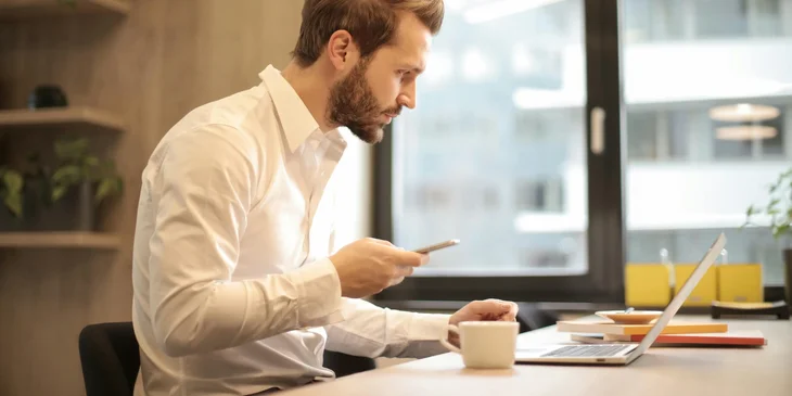 A bid manager conducting online research in preparation for the bid.