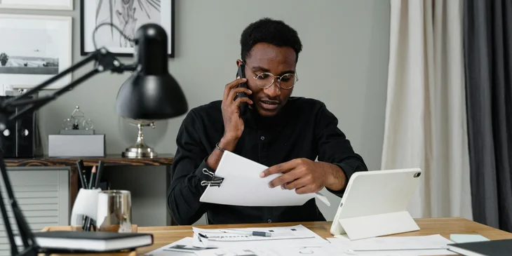 A billing clerk going through account balances.