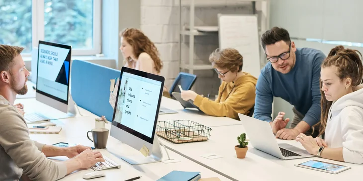 A group of people working in the office.