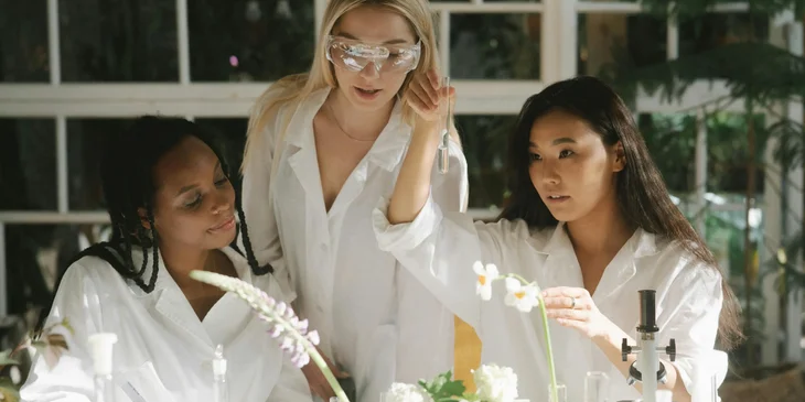 Botanists experimenting with a flower.
