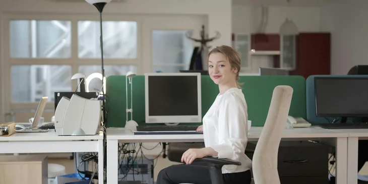 A woman sitting on a chair.