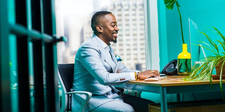 Business analyst working on a computer in an office