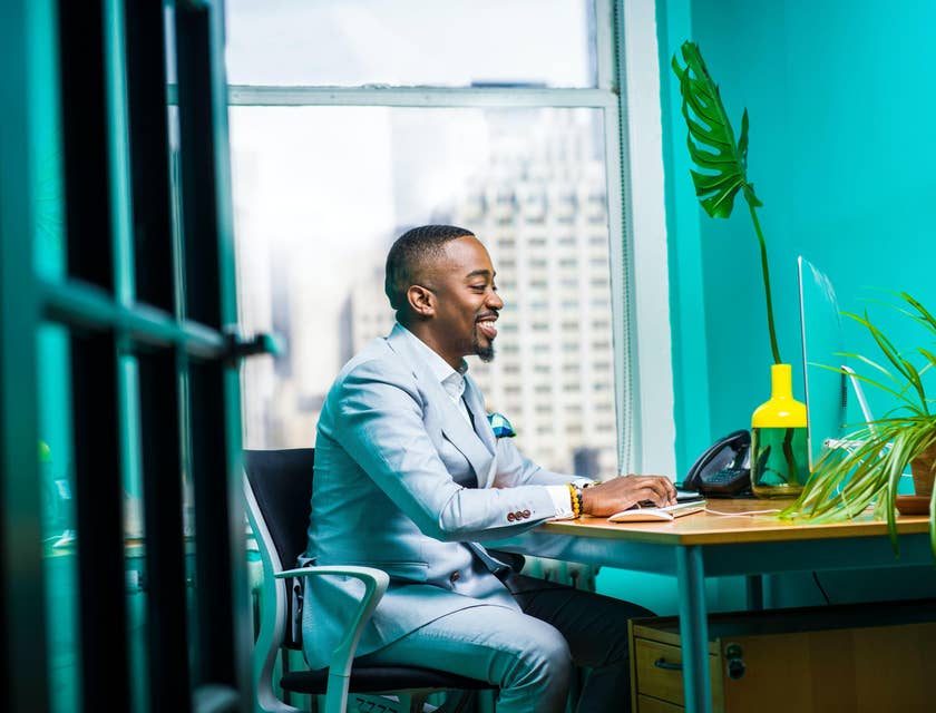 Business analyst working on a computer in an office