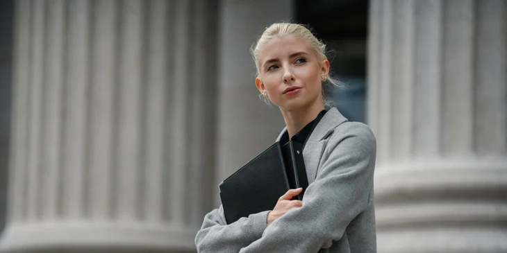 A woman holding her folders.