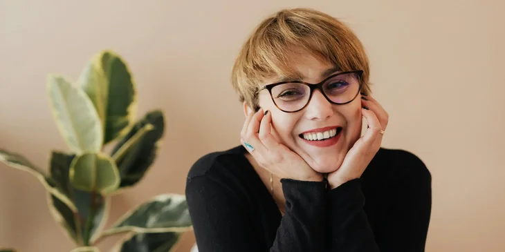 A woman smiling at the camera.