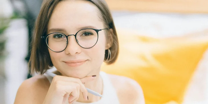 A woman wearing glasses.