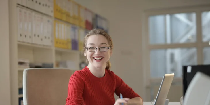 A woman working in an office.