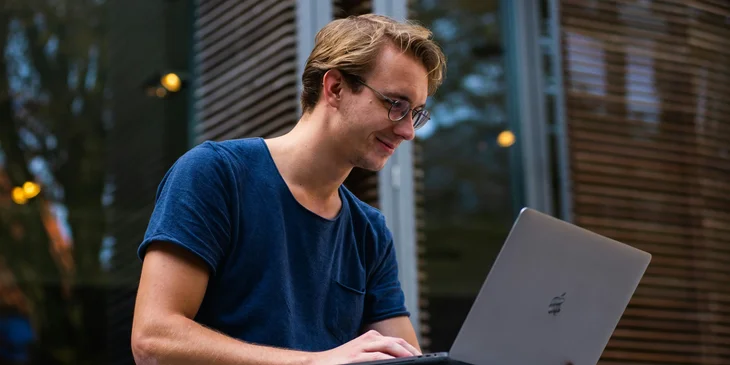 A man using laptop.