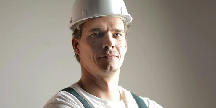 A constructor in helmet and uniform.