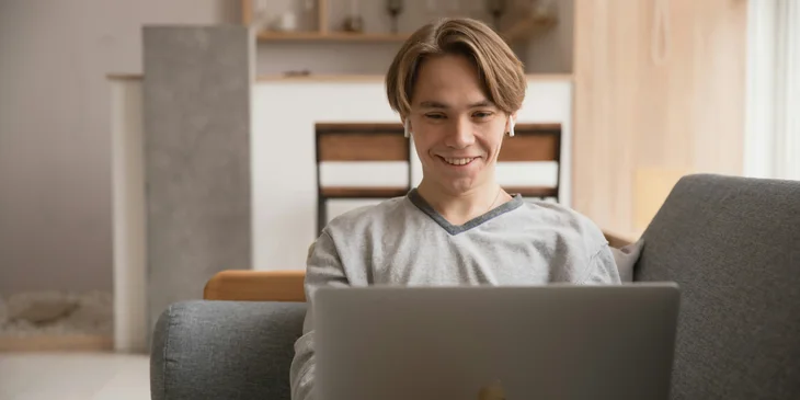 A man using a laptop.