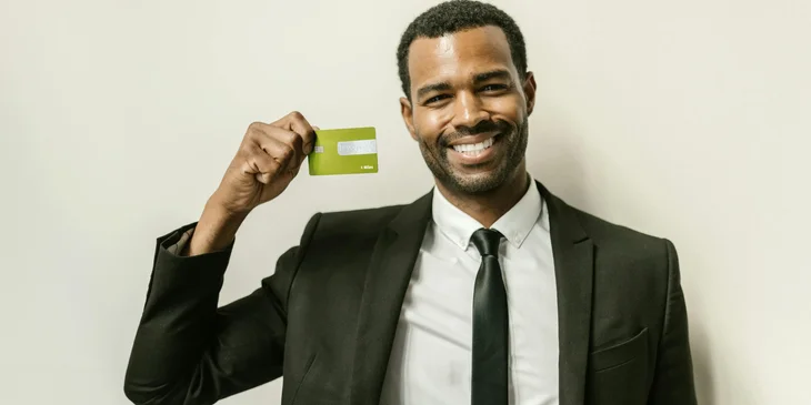 A man holding a card.