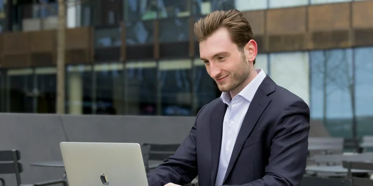 A man using his laptop.