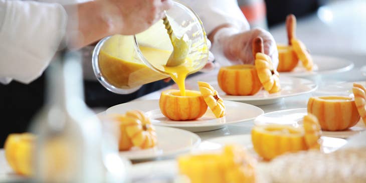 Chefs preparing dishes.