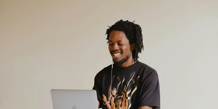 A man watching a video on his laptop.