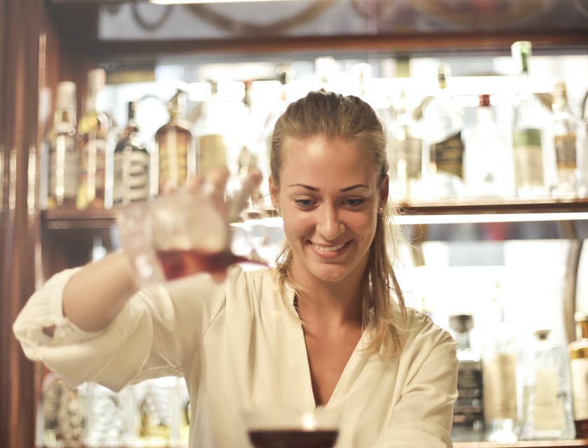 Cocktail Waitress getting ready to serve a drink to a valued customer.