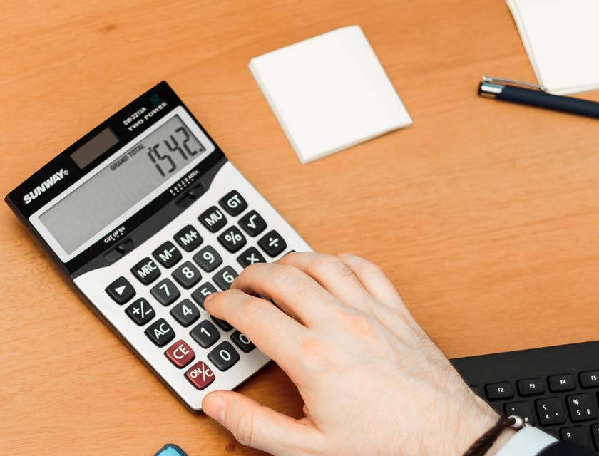 A commercial underwriter calculating risk,