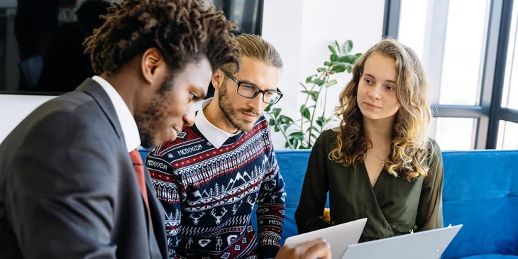 A team discussing marketing materials.