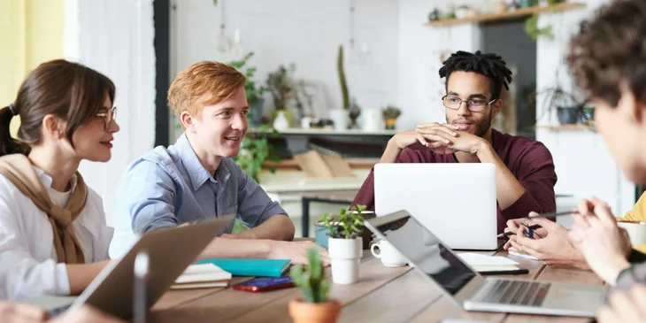A group of individuals from diverse backgrounds working together.