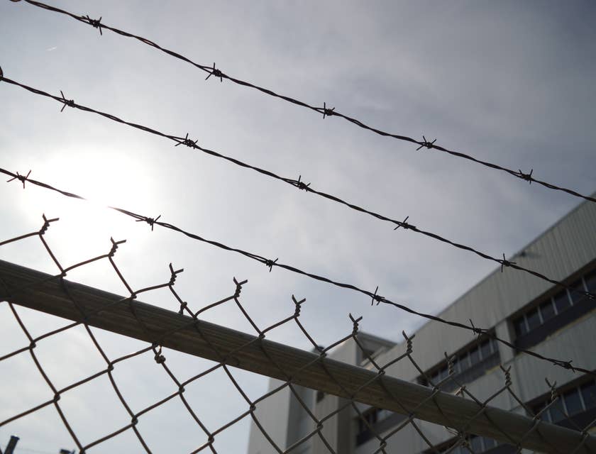 Barbed wire and fencing outside of a correctional facility.