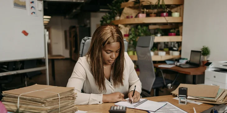 An accountant busy working at her desk.
