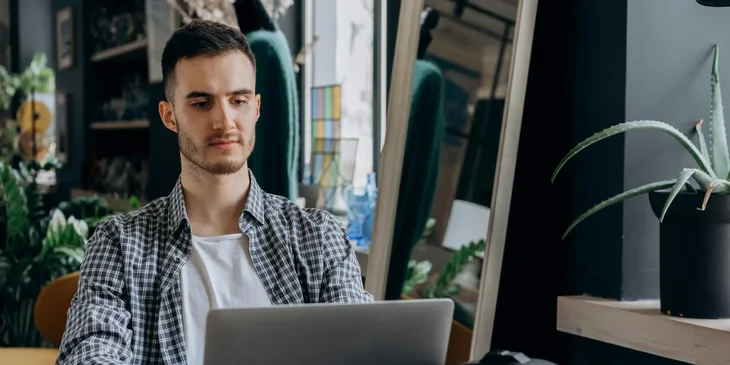 A man using his laptop.