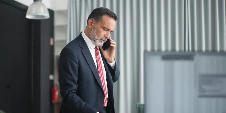 A man talking on the phone.