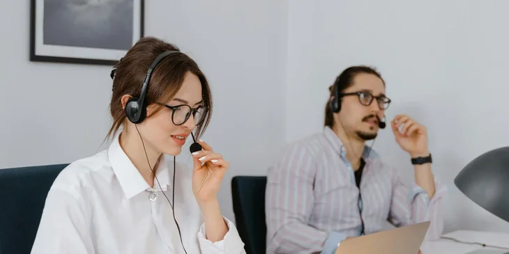 Customer service representatives taking calls using their headset.