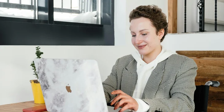 A cyber security analyst working on her laptop.