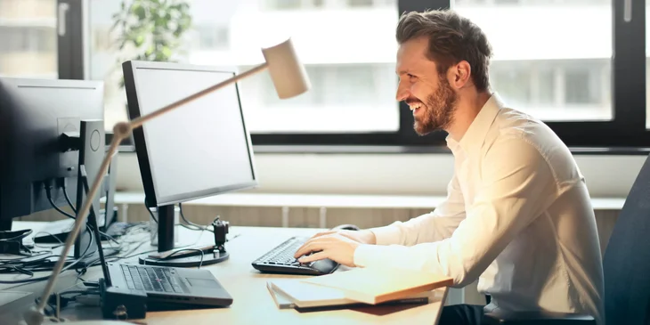 A person typing on a keyboard and entering data into a computer.