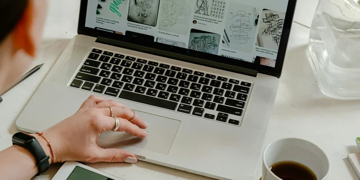 A digital marketing coordinator creating digital marketing material for a new campaign.