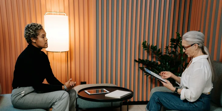 A district sales manager interviewing a candidate for a potential sales representative position.