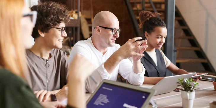 A team of tech professionals having a meeting together.
