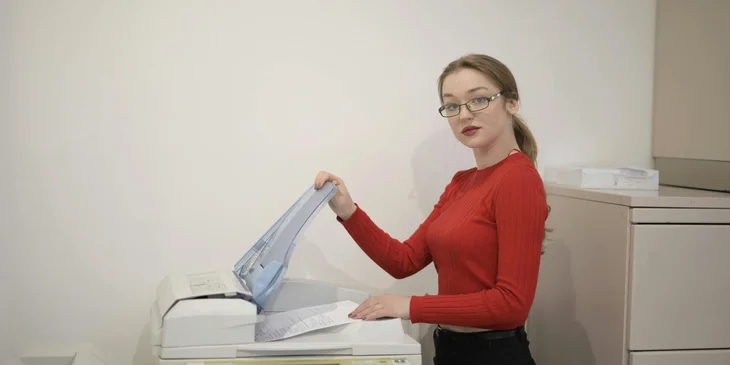 A document controller photocopying some files.