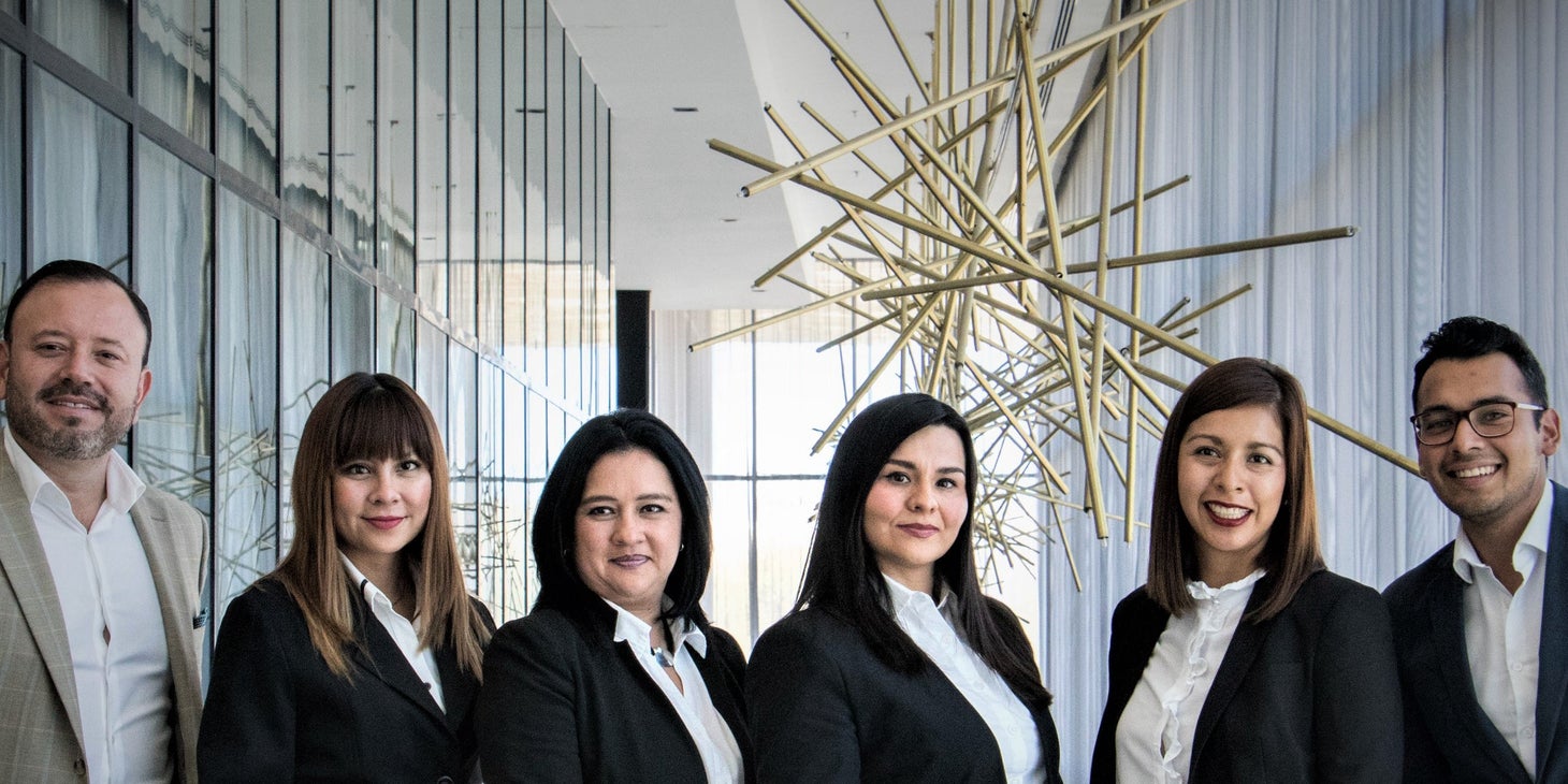 A group of employees in work attire.