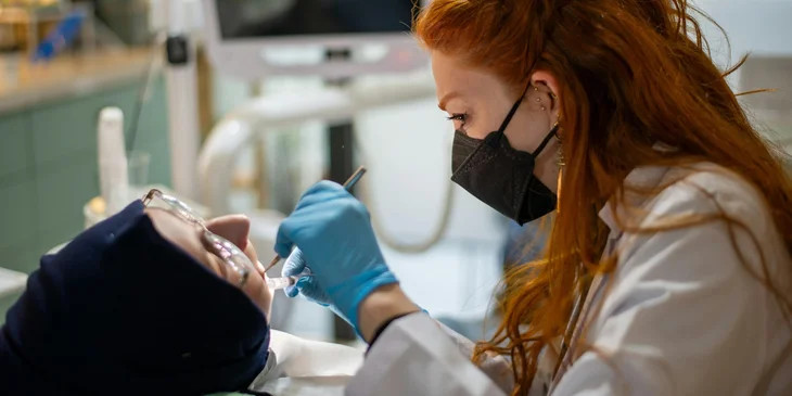 A dentist treating a patient.