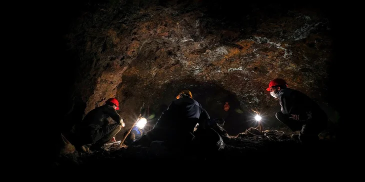 Miners working underground in a mine.