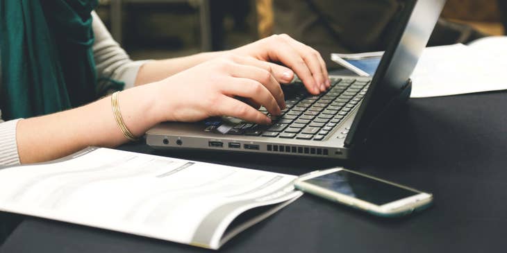 A woman editing and publishing copy on her laptop.