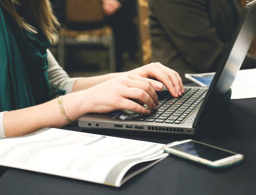 A woman editing and publishing copy on her laptop.
