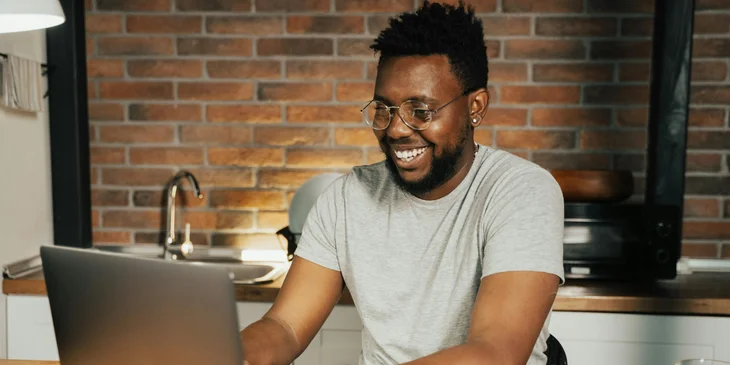 A man working on his laptop.