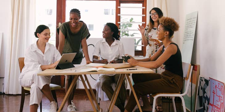 A group of employees engaged in conversation.