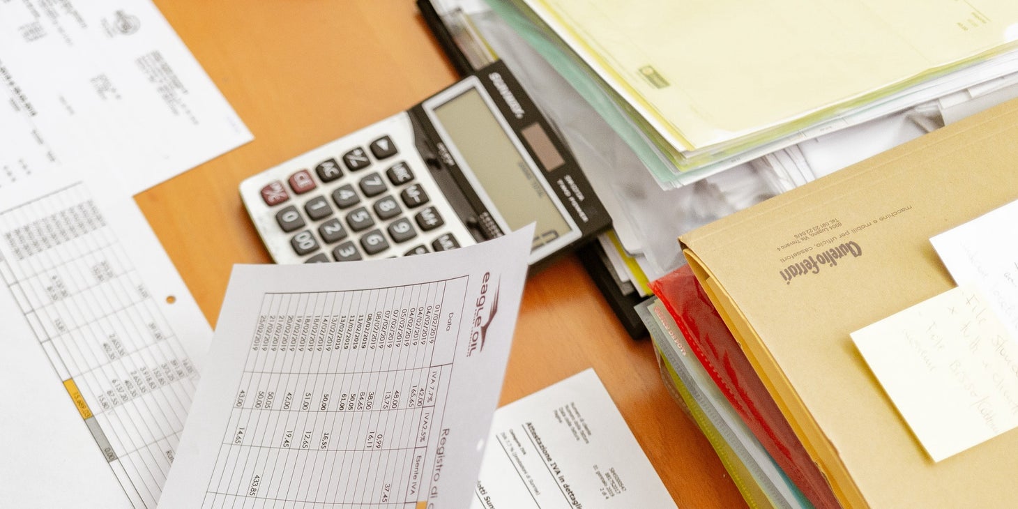 employee holding employee information forms