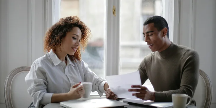 An employer speaking to an employee about some documents.