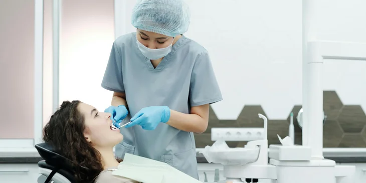 An endodontist checking on the patient’s tooth condition.