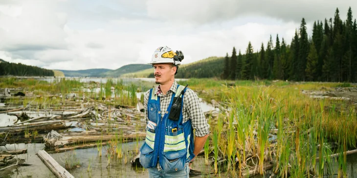 A man wearing a white safety hat.