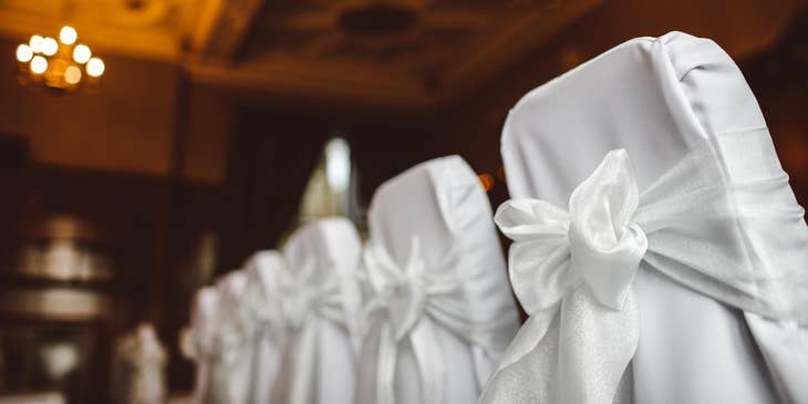 Chairs with white tiebacks at an event